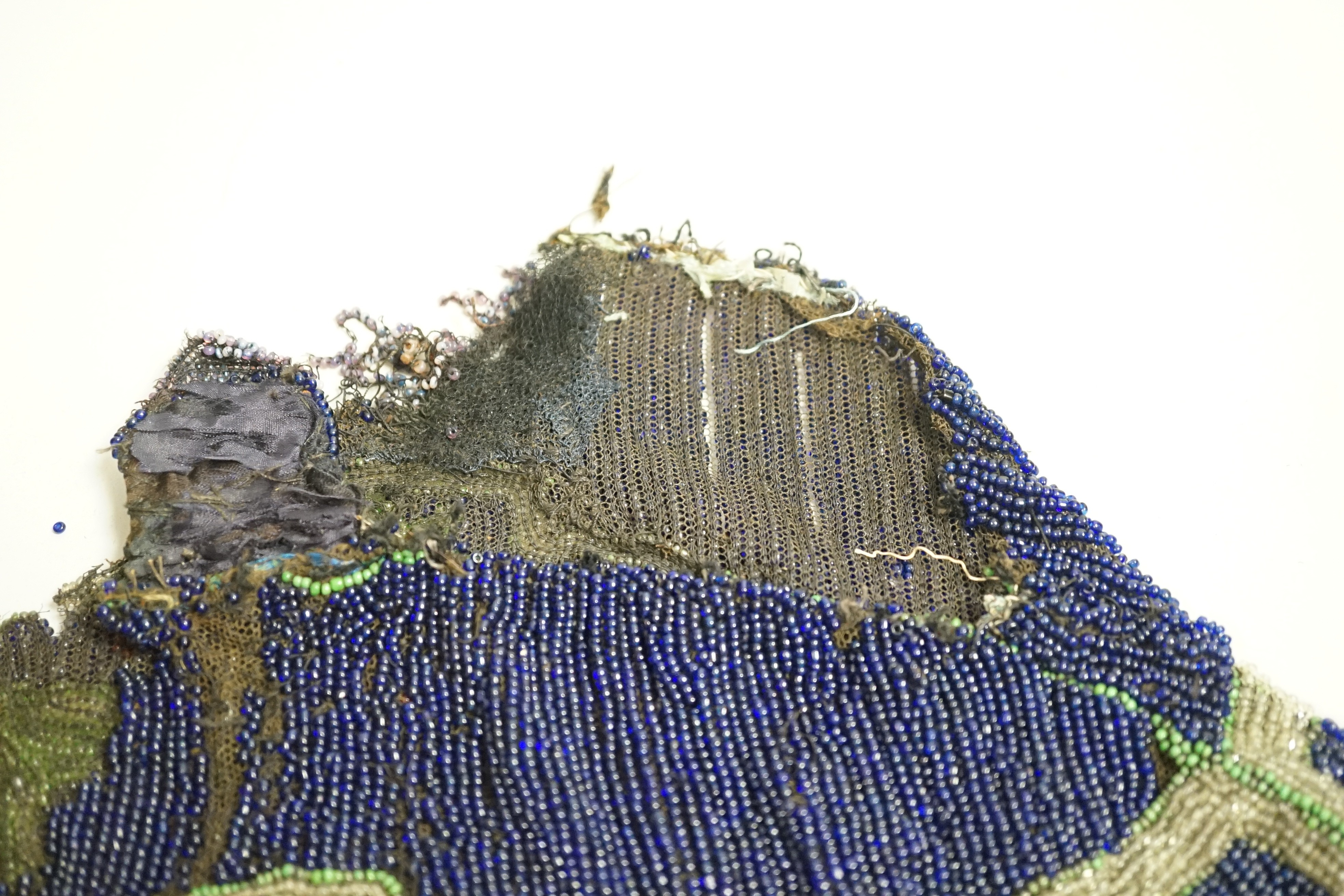 A velvet and metal embroidered reticule possibly 18th century, together with a collection of beaded embroidered knitted and leather purses, bags misers purses and a feather coin purse(14)